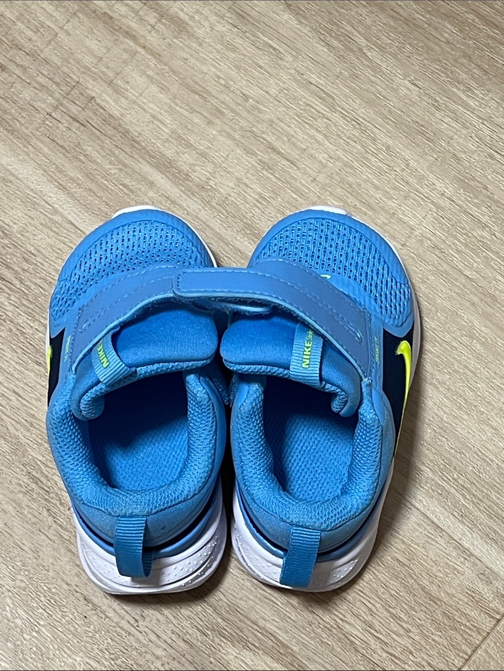Nike Kids Blue Sneakers with Neon Yellow Swoosh